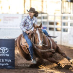 Kerri Holder and er 14yo gelding ''Dually' stop the clock in 17.714 secs to place second in the first section of the Ladies Barrel Race