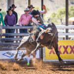 MI215952-Moore Creek NSW cowboy Ty Parkinson marks 77pts on 'Tribal' to split the 1st round 2nd section high score in the Open Bull ride