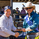 MI217869 Event Sponsor and Bell and Moir Toyota Delaer Principal Lee Pulman presents the Trohpy Buckle to Bareback Champion Fred Osman