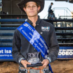 MI218133 21yo Barcaldine cowboy Jackson Gray wins the biggest prize in his 7 year career so far, the Mount Isa Mines Oeen Bull Ride Champion title, his first time competing a