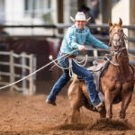 MI223100-Ariat Pro Team cowboy Campbell Hodson get's off his 14yo gelding 'CDee' to stop the clock in 11.90 secs to put them in short go contention