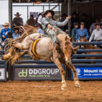 MI224193-Reid Chong marks 65pts to be second in the first section of the 2nd Divi Saddle Bronc ride